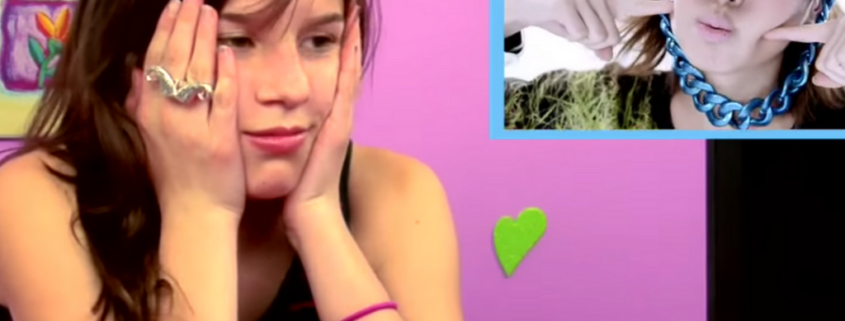 Girl in Fine Bros video sighing while watching "I Am the Best" by 2NE1